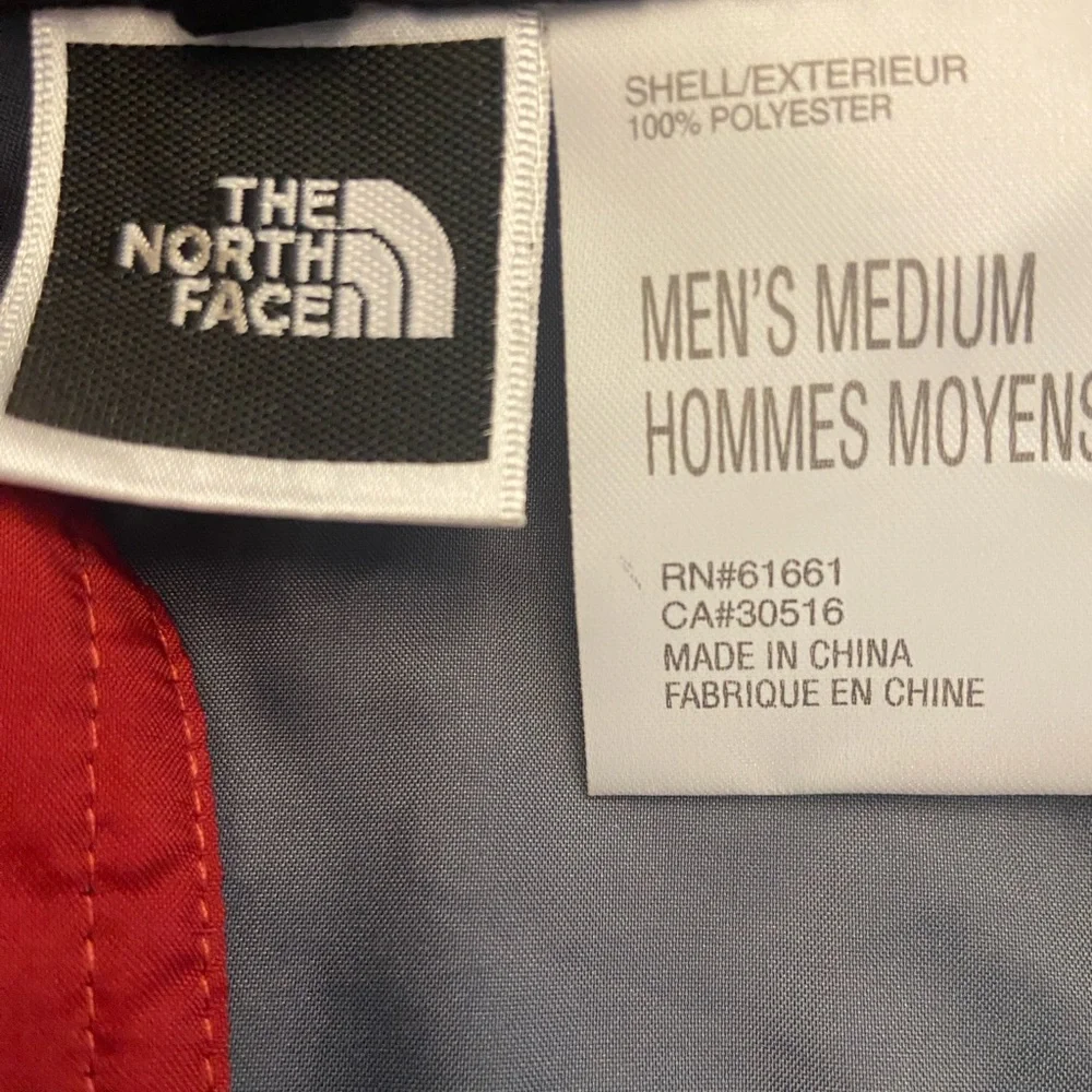 The North Face Men's Gray Windbreaker with Red Accents Size M.